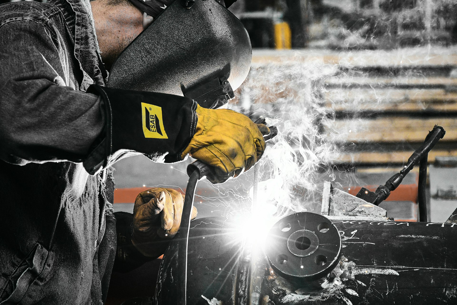 A welder working on a piece of metal